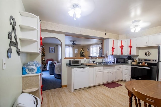 kitchen with dark countertops, electric range, white cabinets, white dishwasher, and black microwave