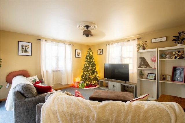 carpeted living area featuring a healthy amount of sunlight