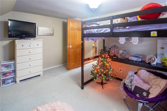 bedroom with light carpet, lofted ceiling, and baseboards