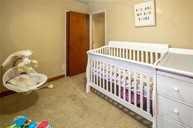 carpeted bedroom with baseboards