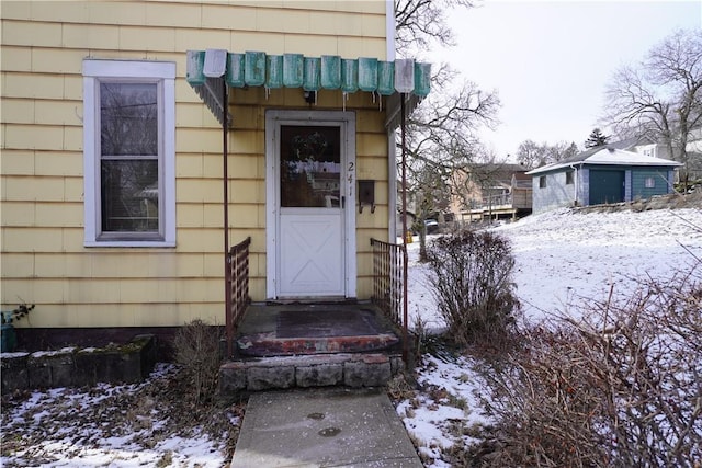 view of snow covered property entrance