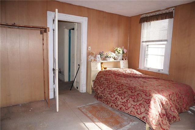 bedroom with wood walls