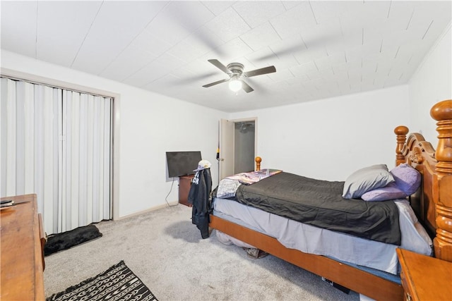 bedroom with ceiling fan and light colored carpet