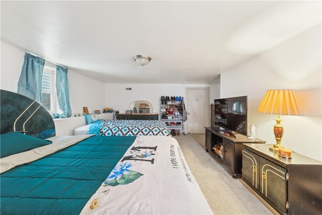 bedroom with light colored carpet