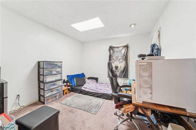 bedroom with a skylight, baseboards, and carpet flooring