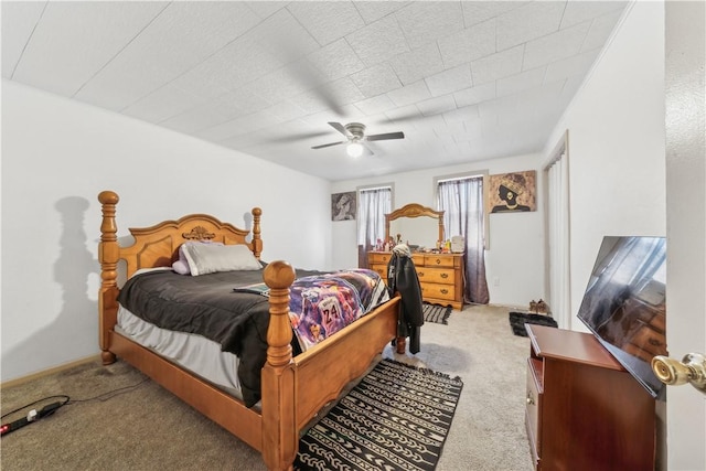 bedroom with light carpet and a ceiling fan