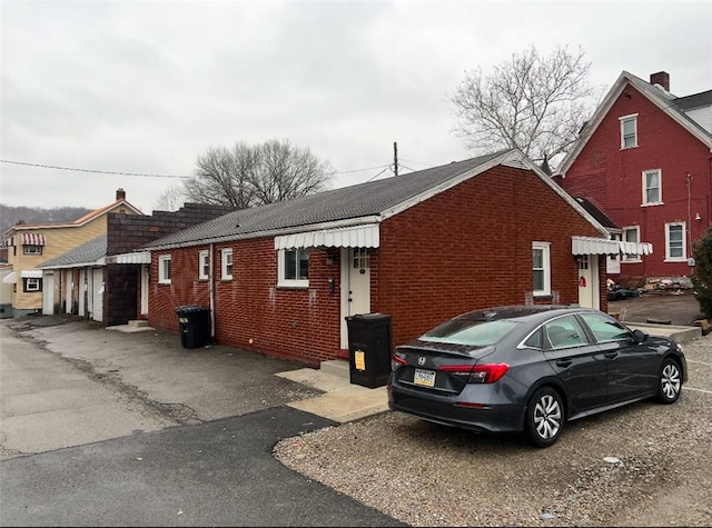 view of side of property with brick siding