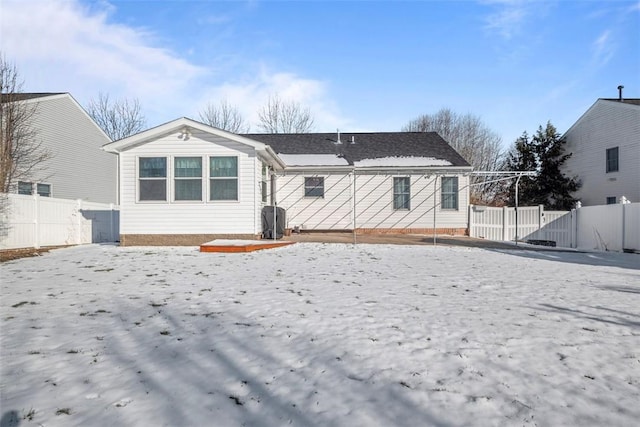 rear view of house with fence