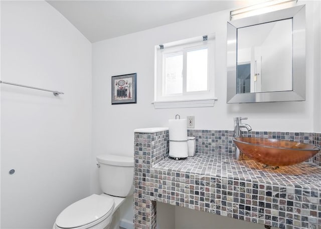 bathroom featuring toilet and a sink