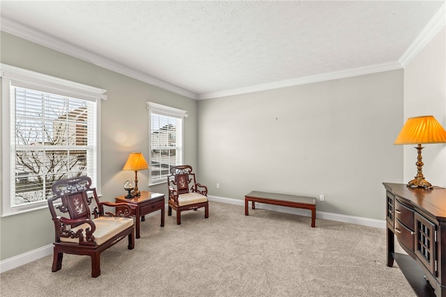 sitting room featuring baseboards, ornamental molding, and light colored carpet