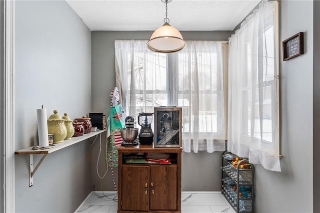 interior space featuring marble finish floor