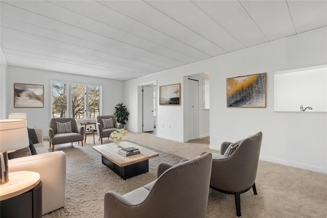 living room with light carpet and baseboards