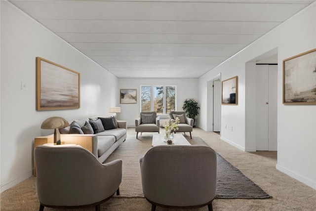 living area with light carpet and baseboards