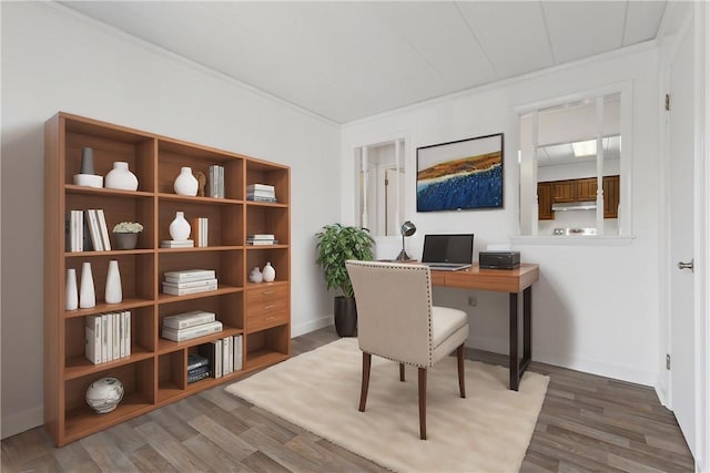 office area with crown molding and wood finished floors