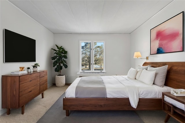 bedroom featuring light carpet