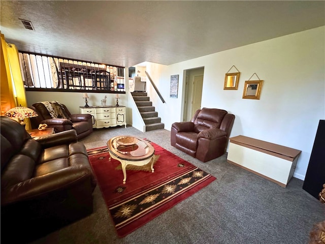 living room featuring stairs, carpet flooring, visible vents, and baseboards