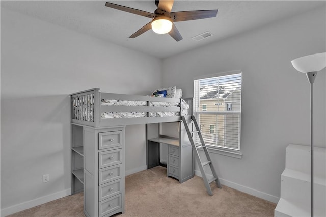 bedroom featuring a ceiling fan, light colored carpet, visible vents, and baseboards