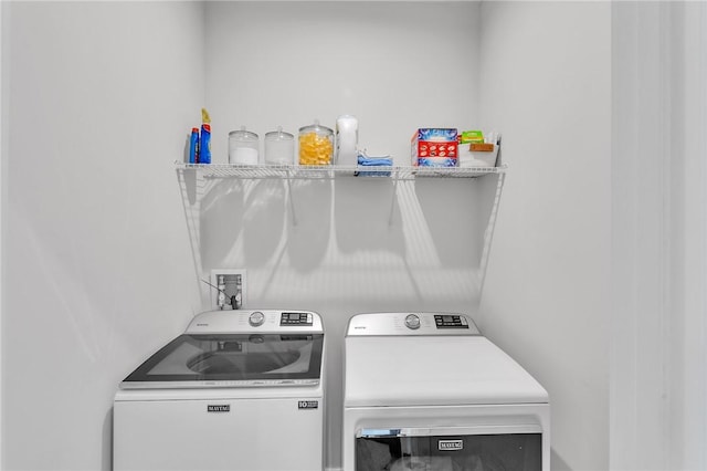 clothes washing area featuring laundry area and independent washer and dryer