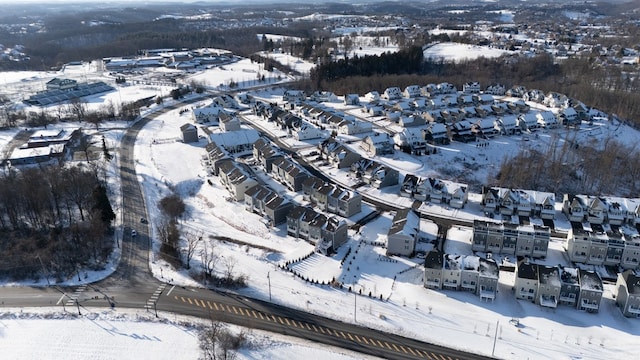 snowy aerial view featuring a residential view