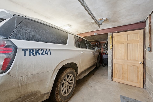 garage with concrete block wall