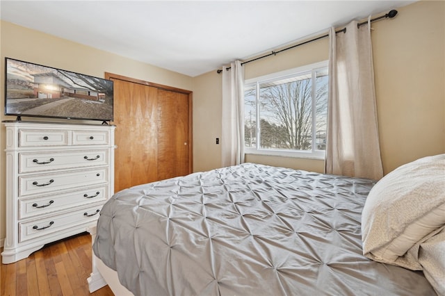 bedroom featuring a closet and wood finished floors