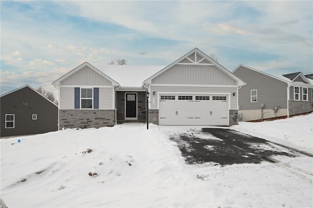 craftsman-style house with a garage, stone siding, and board and batten siding