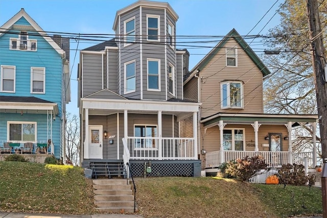 view of front of property with a porch and a front yard