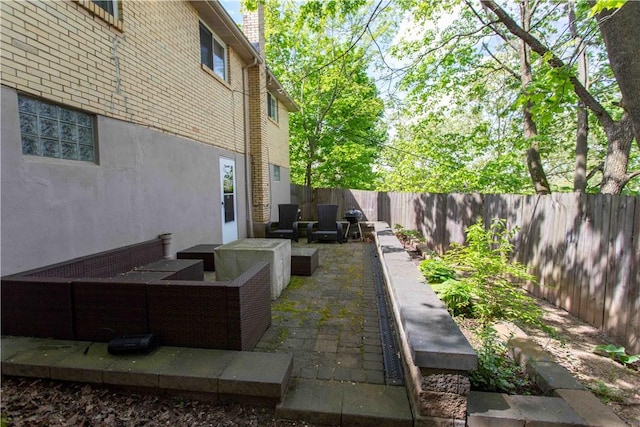 view of patio with outdoor lounge area and a fenced backyard