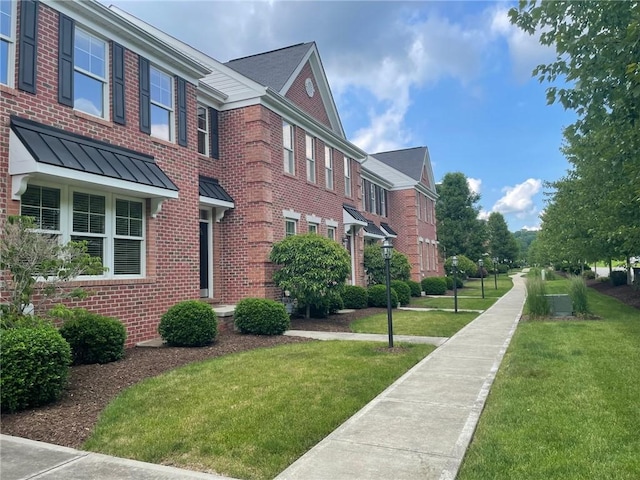 view of property's community with a yard