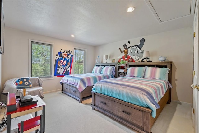 bedroom with light carpet, recessed lighting, and baseboards