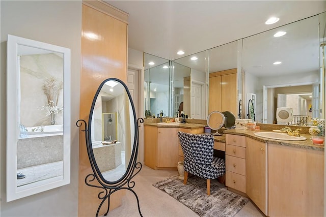 bathroom featuring recessed lighting and vanity