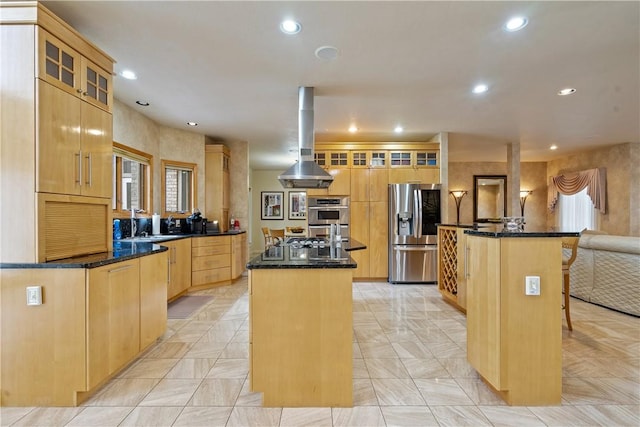 kitchen with an island with sink, dark countertops, glass insert cabinets, and stainless steel appliances
