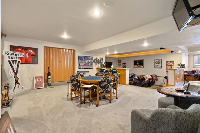 dining space with light carpet, baseboards, and recessed lighting