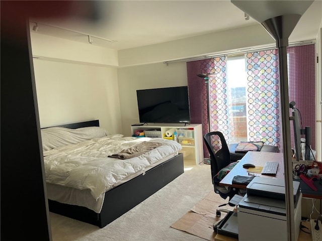 bedroom featuring light colored carpet