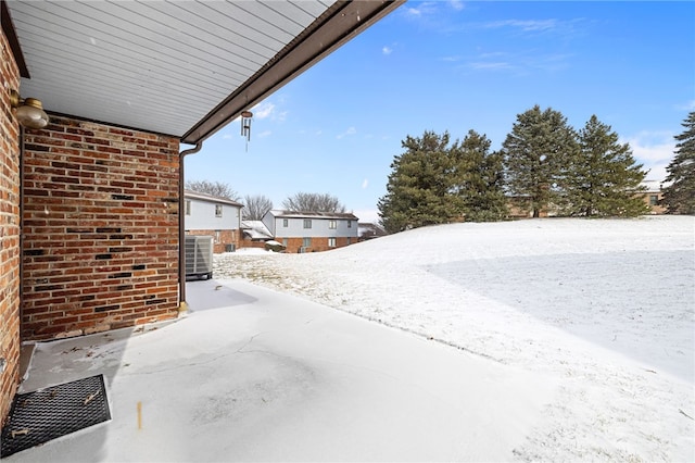 yard layered in snow with cooling unit