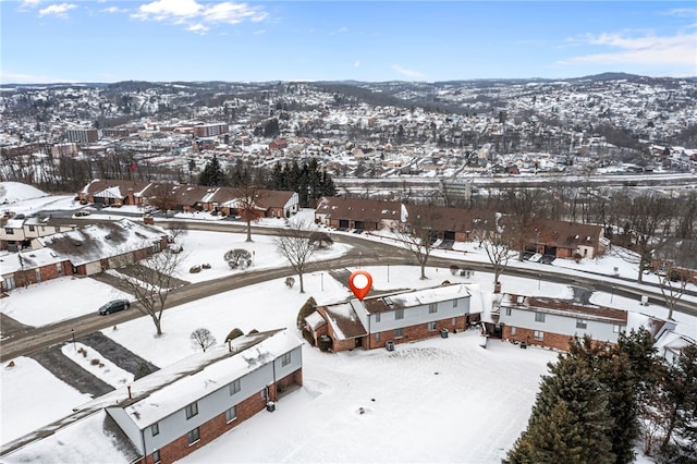 snowy aerial view featuring a residential view