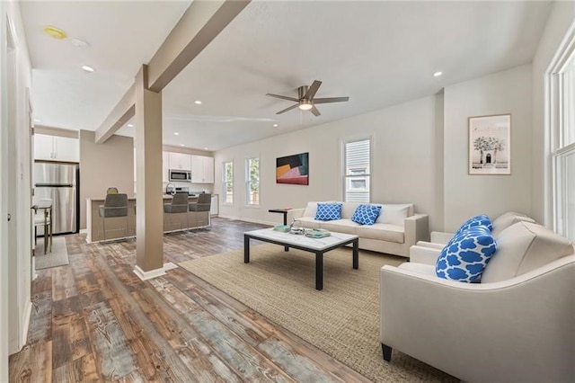 living area with ceiling fan, baseboards, wood finished floors, and recessed lighting