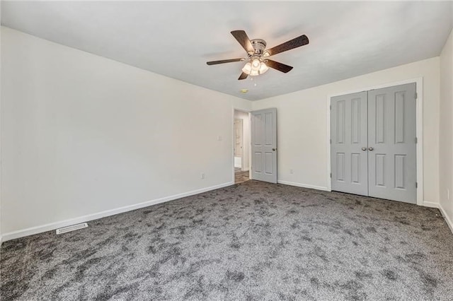 unfurnished bedroom with carpet floors, a closet, ceiling fan, and baseboards