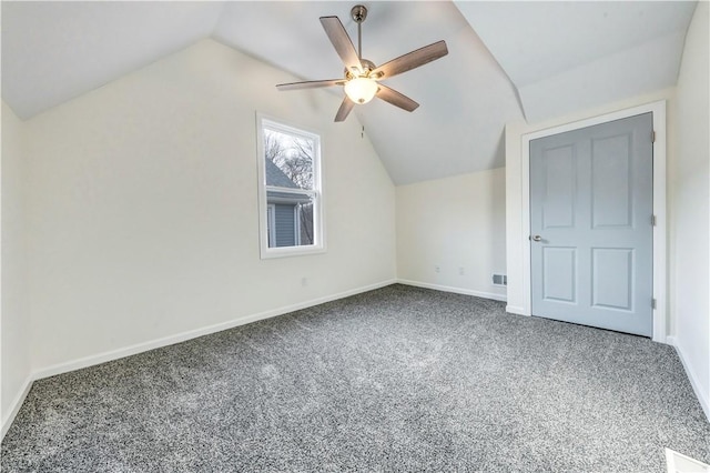 additional living space featuring lofted ceiling, ceiling fan, baseboards, and carpet flooring