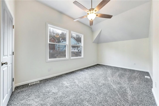 bonus room featuring visible vents, baseboards, ceiling fan, vaulted ceiling, and carpet floors