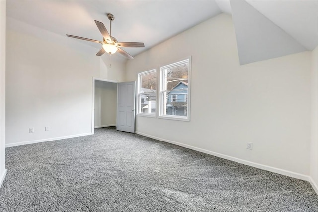 unfurnished bedroom featuring lofted ceiling, ceiling fan, carpet flooring, and baseboards