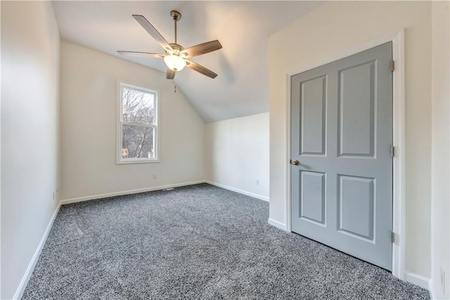 additional living space with carpet floors, lofted ceiling, ceiling fan, and baseboards