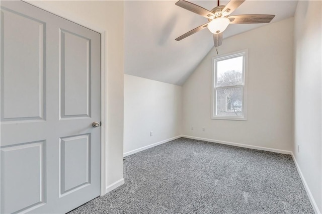 additional living space featuring lofted ceiling, carpet, a ceiling fan, and baseboards