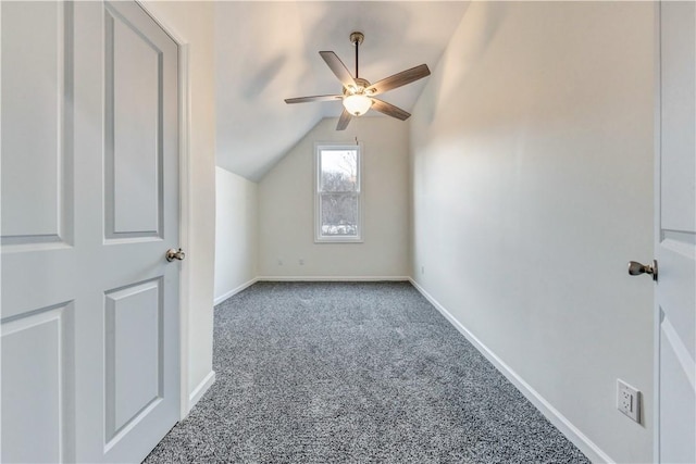 additional living space featuring lofted ceiling, carpet flooring, ceiling fan, and baseboards