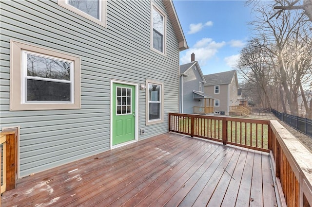 wooden terrace featuring fence