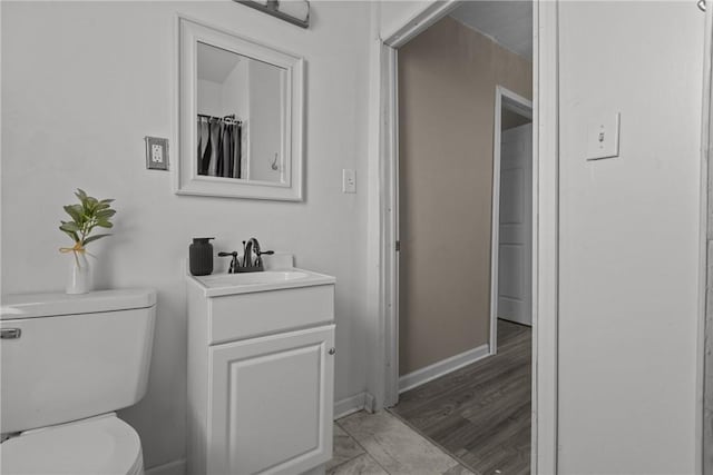 1155 6th Ave, Freedom, PA 15042 - bathroom featuring vanity, baseboards, and toilet