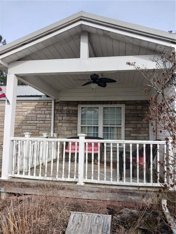 exterior space with ceiling fan and a porch