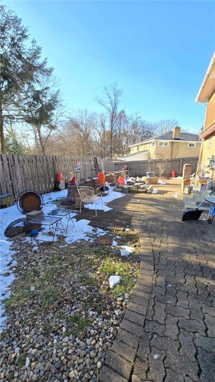 view of yard with a patio area and a fenced backyard