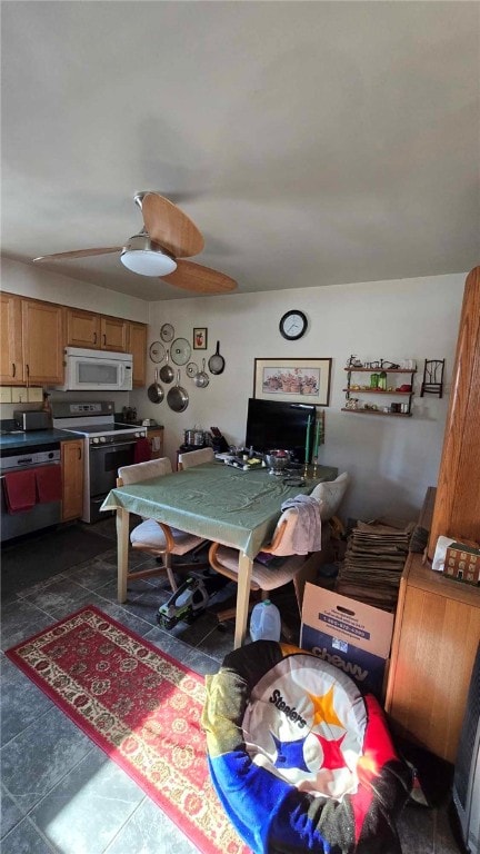 dining area featuring dark tile patterned flooring