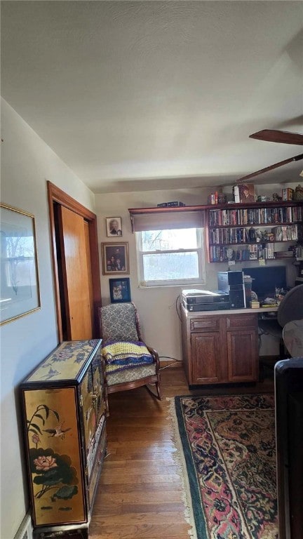 office with a ceiling fan and dark wood-style flooring